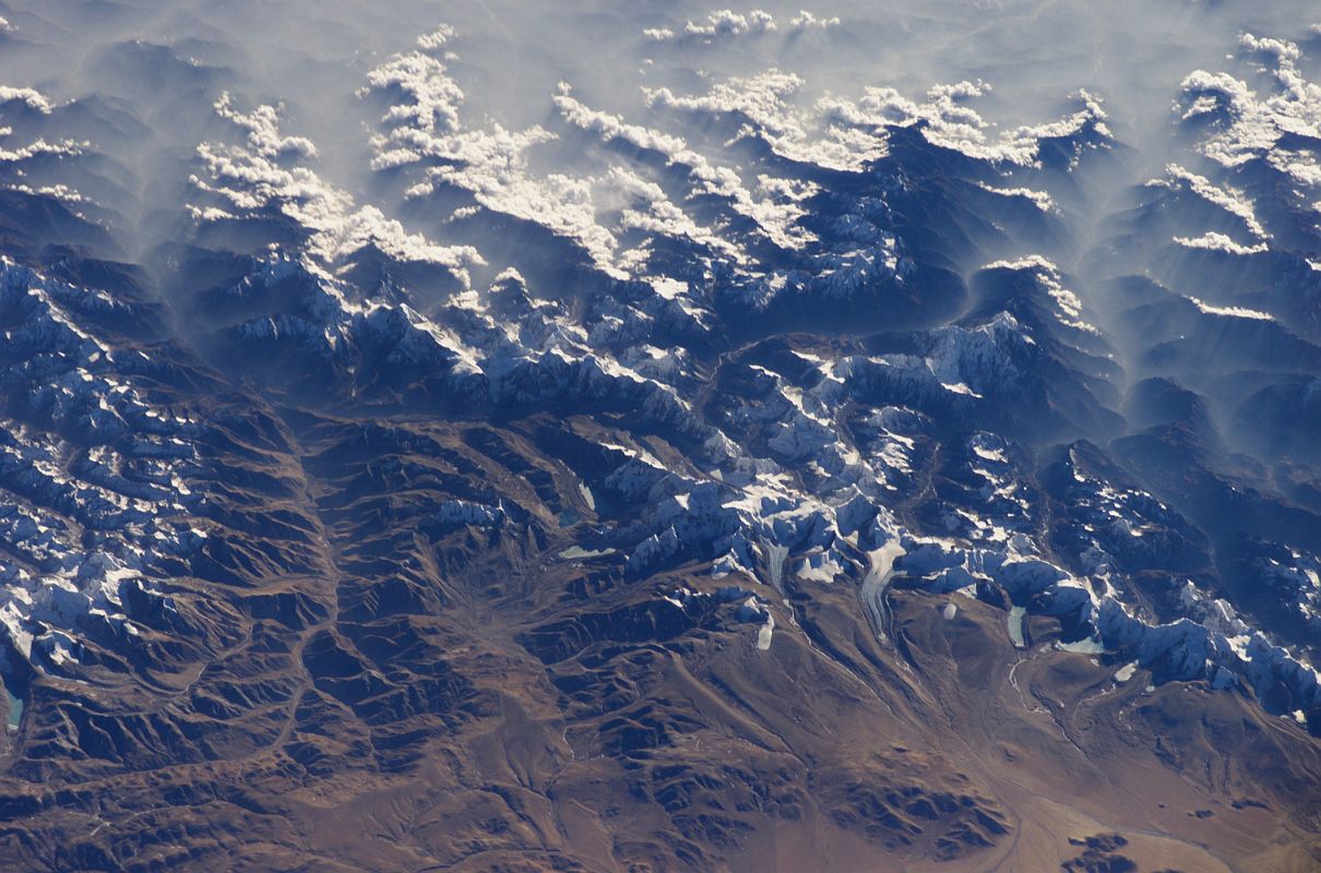 Shishapangma 02 02 Nasa ISS008-E-6355 From West Nasa ISS008-E-6355 was taken on 2003-11-28 from the east. Shishapangma is in the lower centre. The valley towards Nyalam goes up in the left. The valley from Nyalam to the Southwest face goes from left to right in the centre, with Jugal Himal mountains Phurbi Ghyachu (6658m) and Lenpo Gang (Big White Peak 7083m) at the beginning of the valley.